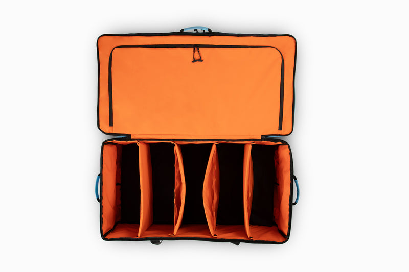Blue travel bag open to orange interior empty