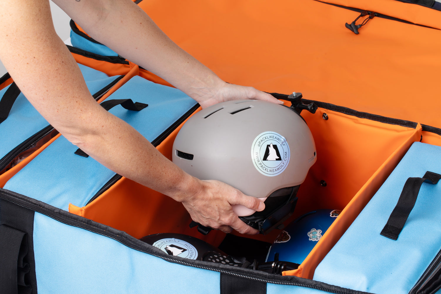 Helmet being placed in the alpha family pack